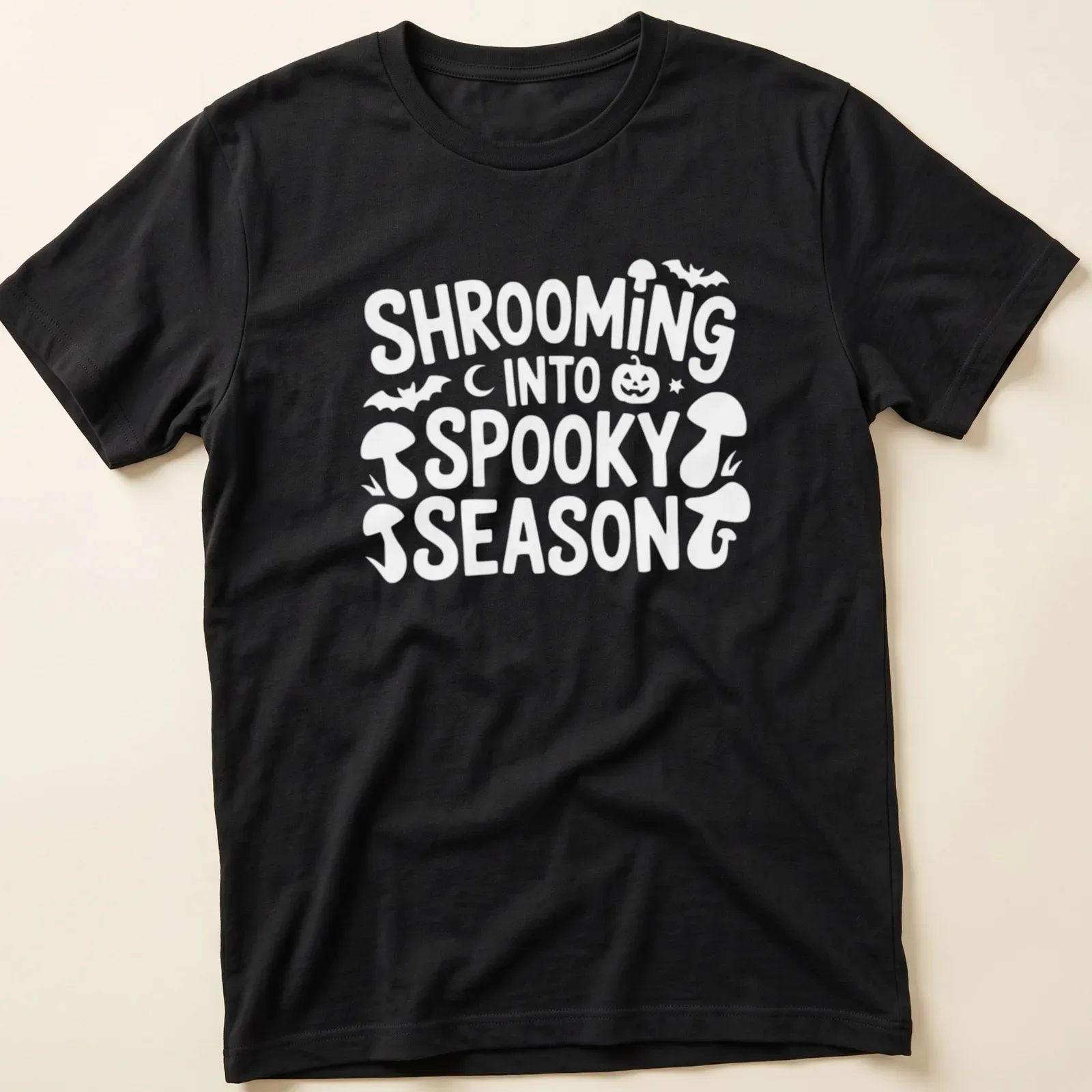 Playful cartoon design of mushrooms for spooky season with vibrant colors — printed on a unisex t-shirt