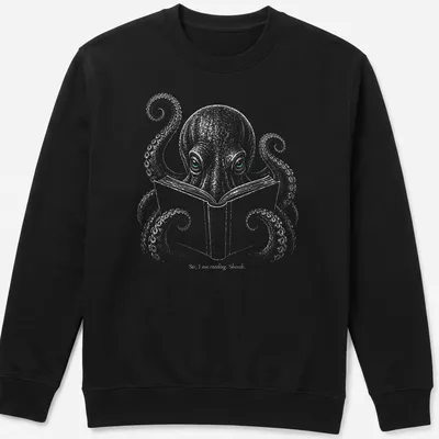 Illustration of an octopus reading a book with humorous text. — printed on a unisex sweatshirt
