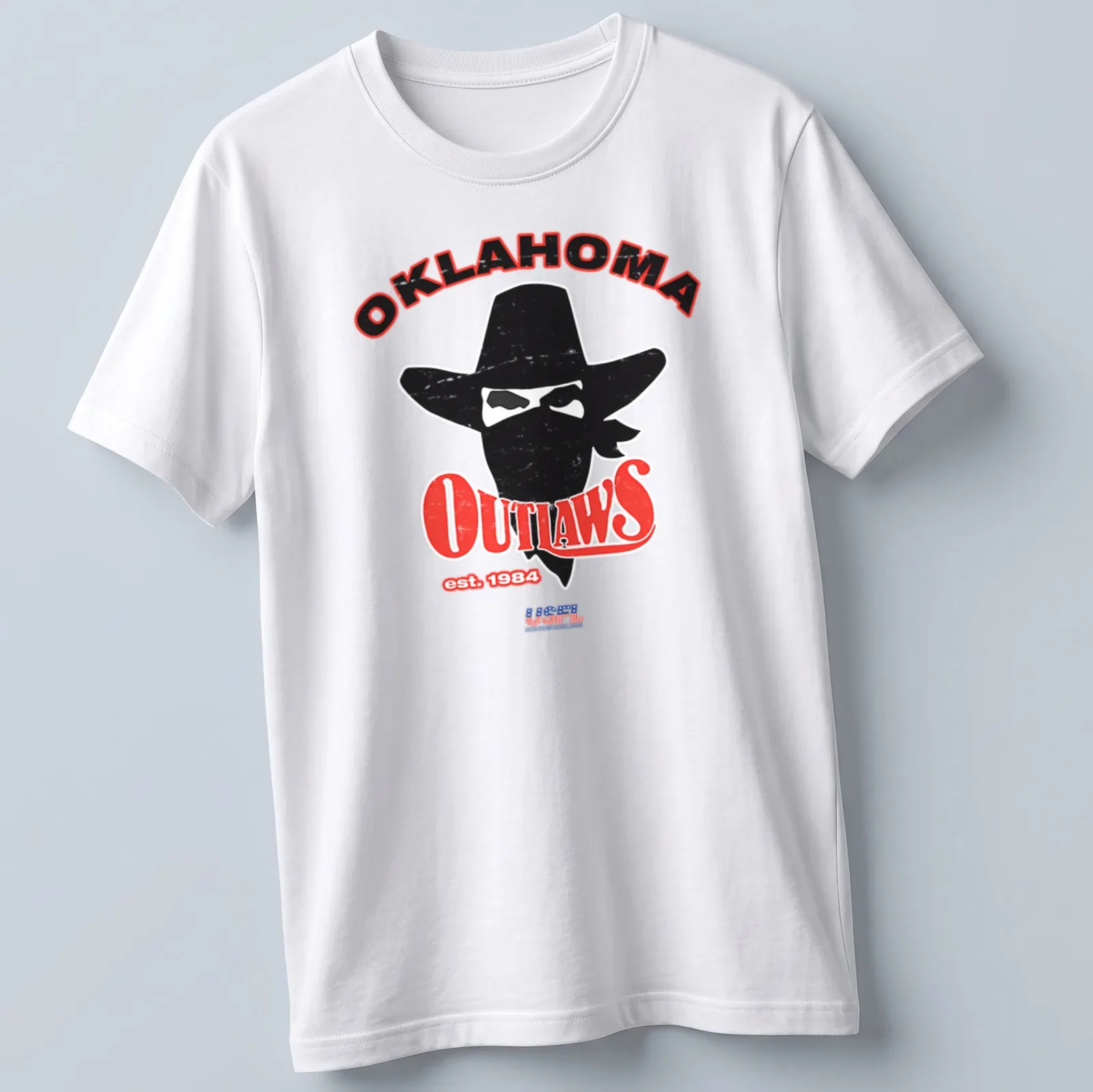 Retro distressed print featuring a cowboy with a hat and bandana above Oklahoma Outlaws text — printed on a unisex t-shirt