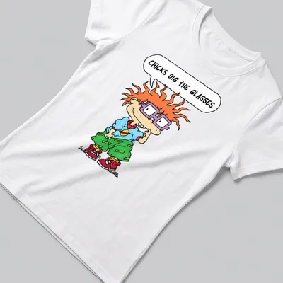 Cartoon boy with orange hair and purple glasses, text reads 'CHICKS DIG THE GLASSES' — printed on a women's shirt
