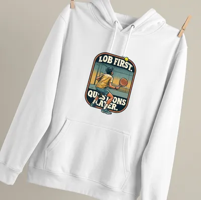 Vintage illustration of a padel player with the text 'LOB FIRST. QUESTIONS LATER.' — printed on a unisex hoodie