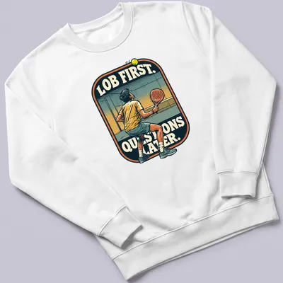 Vintage illustration of a padel player with the text 'LOB FIRST. QUESTIONS LATER.' — printed on a unisex sweatshirt