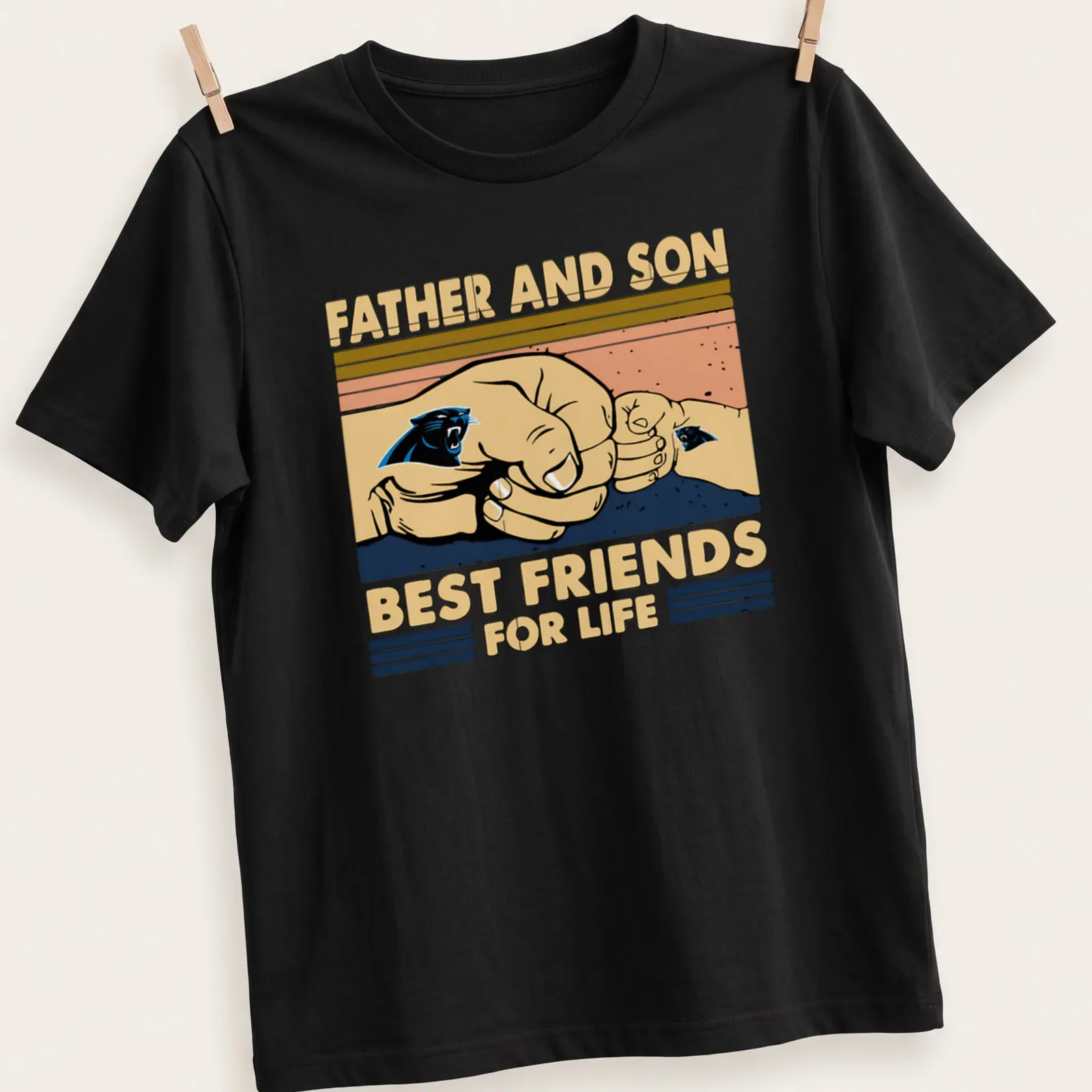 Illustration of father and son hands showcasing the Panthers logo with text about friendship — printed on a unisex t-shirt
