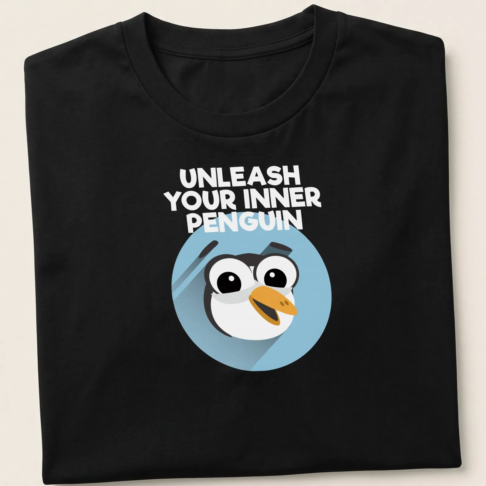 Cartoon penguin with motivational text 'You Can Do It' in light blue and black — printed on a unisex t-shirt