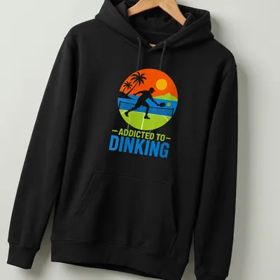 Tropical style tee featuring pickleball themed text in bright colors — printed on a unisex hoodie