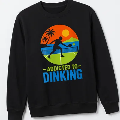 Tropical style tee featuring pickleball themed text in bright colors — printed on a unisex sweatshirt