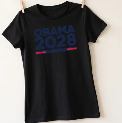 Bold typography shirt featuring 'OBAMA 2028' in navy blue, white, and red. — printed on a women's shirt