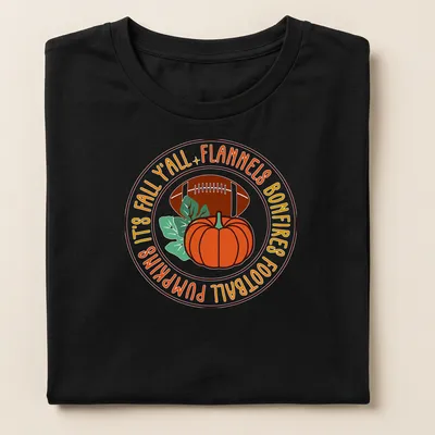 Vintage-style shirt featuring pumpkins and football with fall-themed text. — printed on a women's shirt