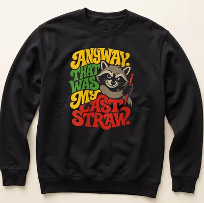 Colorful illustration of a raccoon with humorous text about frustration — printed on a unisex sweatshirt