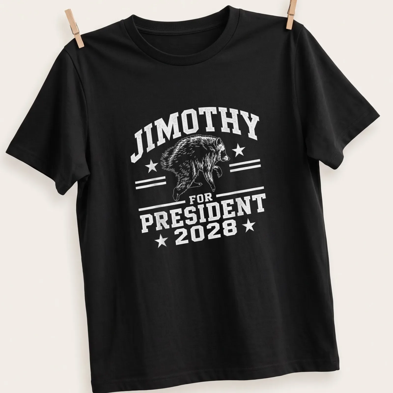 Vintage distressed t-shirt with a humorous raccoon character and political text — printed on a unisex t-shirt