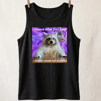 Funny raccoon meme t-shirt featuring humorous text with a cartoon raccoon — printed on a tank top