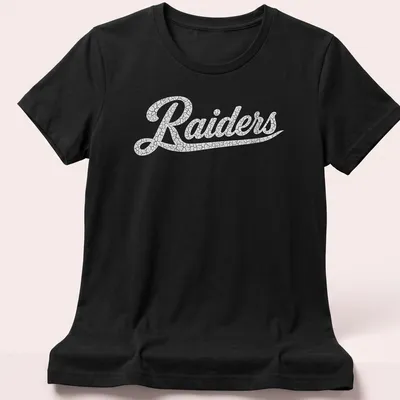 Vintage Raiders t-shirt with bold printed text and distressed design — printed on a women's shirt