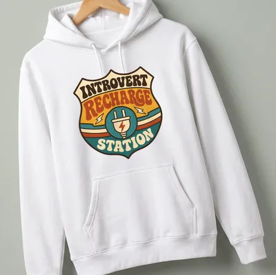 Retro tee featuring an Introvert Recharge Station with colorful groovy design — printed on a unisex hoodie