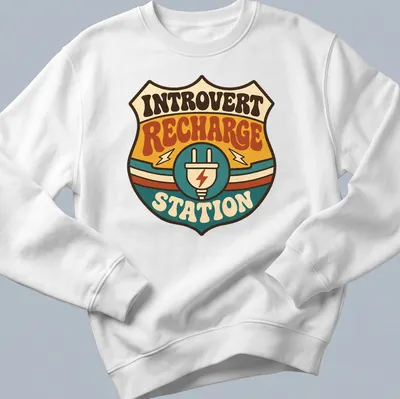 Retro tee featuring an Introvert Recharge Station with colorful groovy design — printed on a unisex sweatshirt