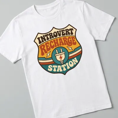 Retro tee featuring an Introvert Recharge Station with colorful groovy design