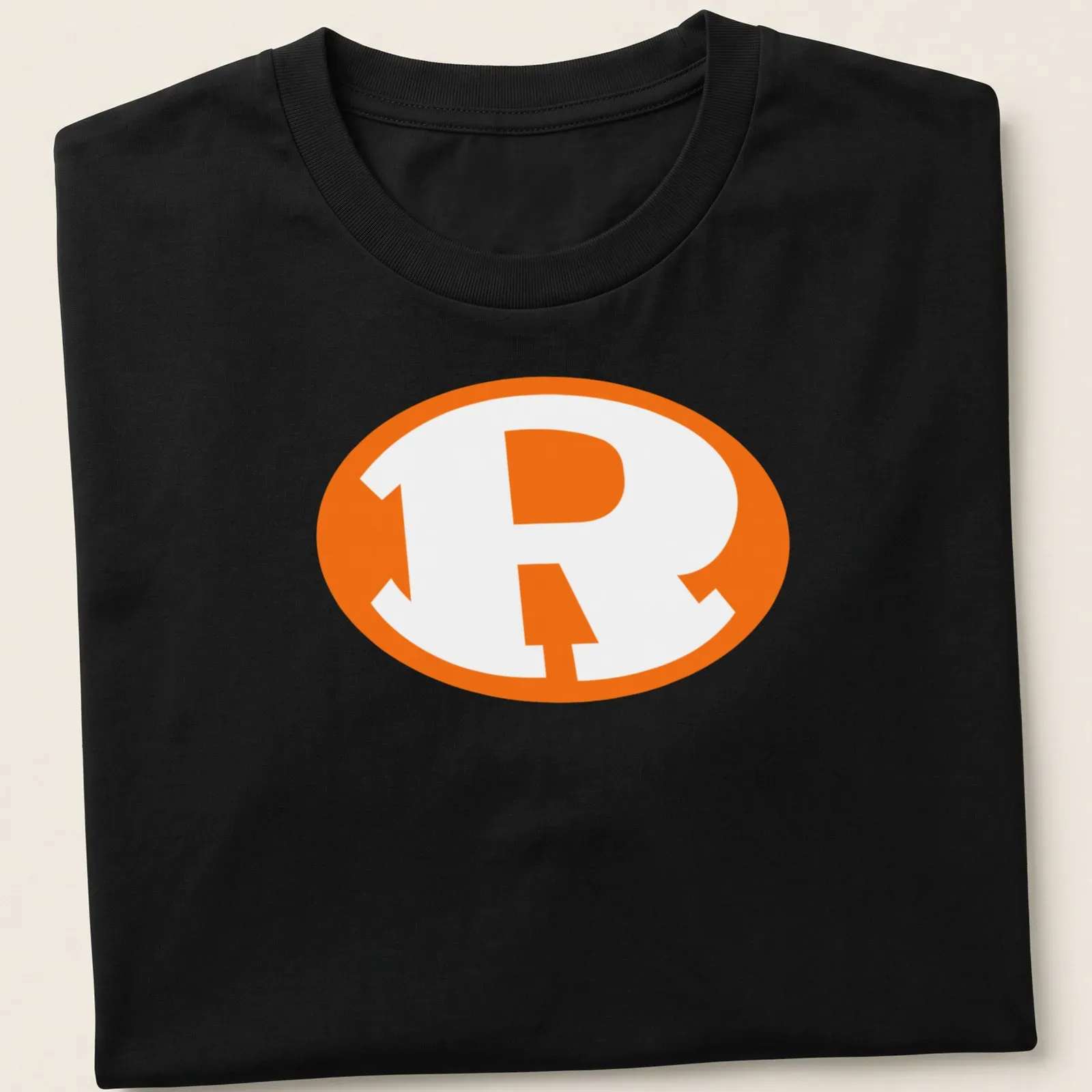 Bold graphic of the Rockwall Yellowjackets logo in orange and white — printed on a unisex t-shirt