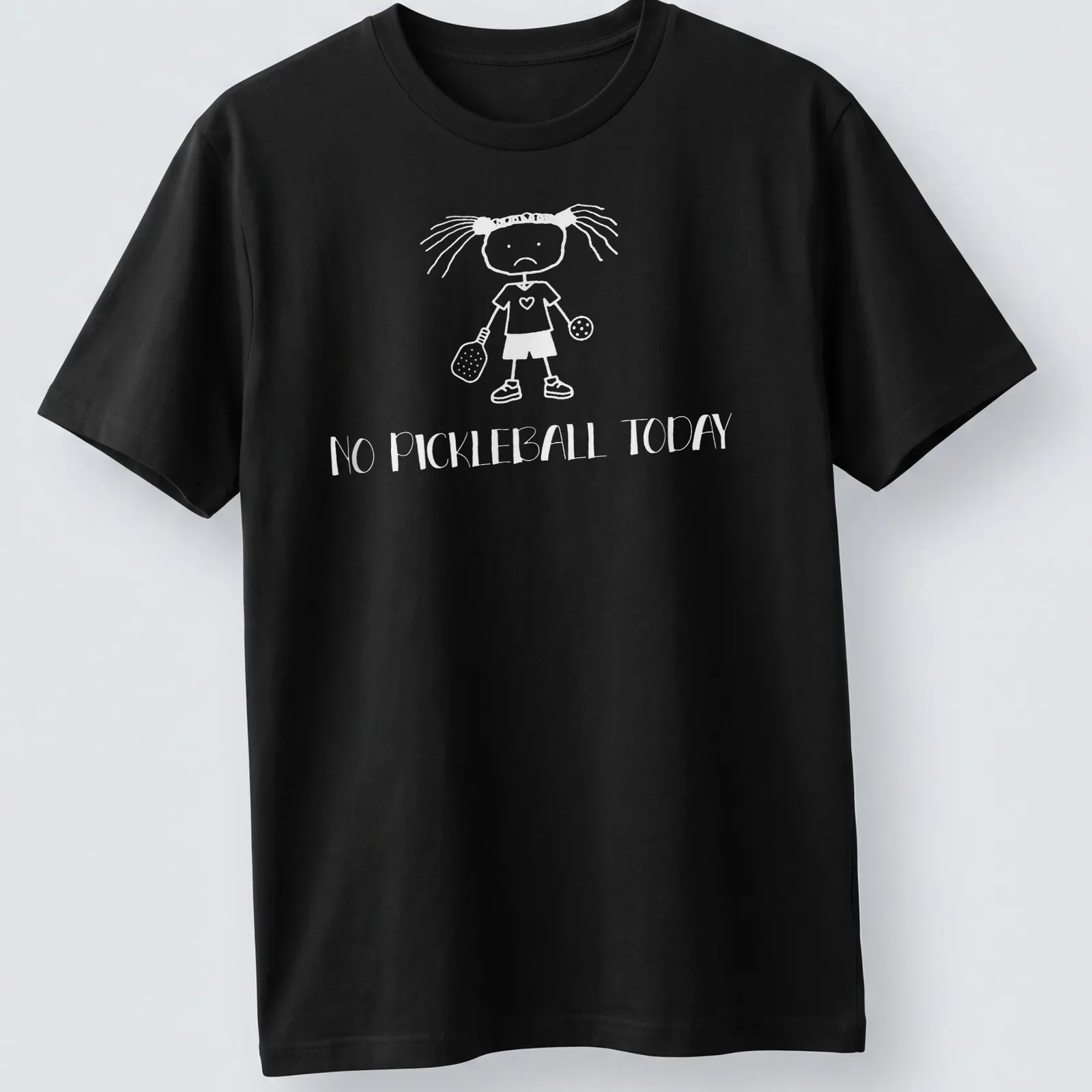 Cartoon design of a sad girl with a pickleball paddle and balls, text 'NO PICKLEBALL TODAY' — printed on a unisex t-shirt