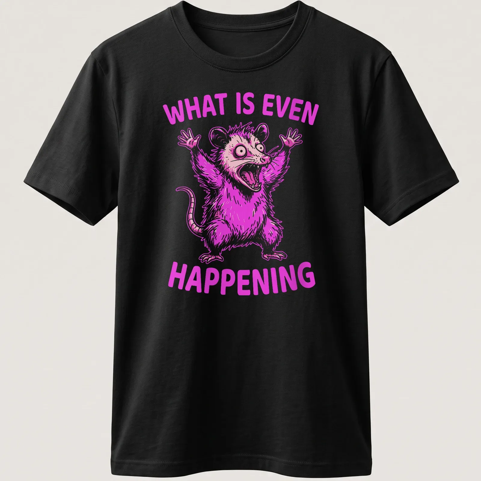 Bold cartoon of a screaming opossum with the text 'WHAT IS EVEN HAPPENING' in pink and white — printed on a unisex t-shirt