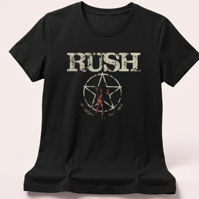 Vintage distressed t-shirt featuring silhouette figure and Rush American Tour 1977 text — printed on a women's shirt