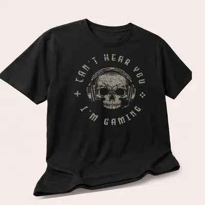 Distressed vintage gaming t-shirt featuring a skull with a headset and the text 'Can't Hear You I'm Gaming' — printed on a unisex t-shirt (angled view)