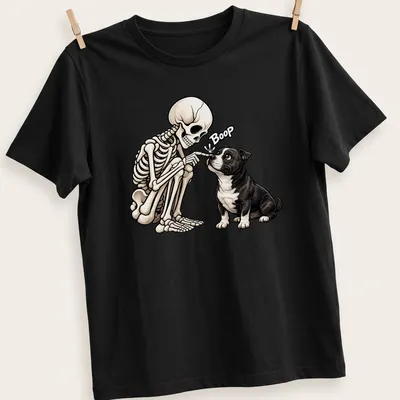 Cartoon Staffordshire Bull Terrier with skeleton, with the word Boop in black and beige — printed on a unisex t-shirt