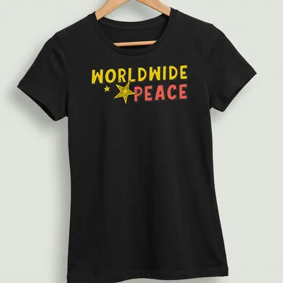 Bold cartoon graphic of a star with 'WORLDWIDE PEACE' text in yellow, red, and black — printed on a women's shirt