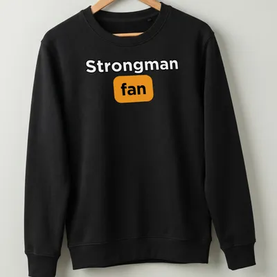 Bold typography Strongman Fan t-shirt in black, orange, and white — printed on a unisex sweatshirt