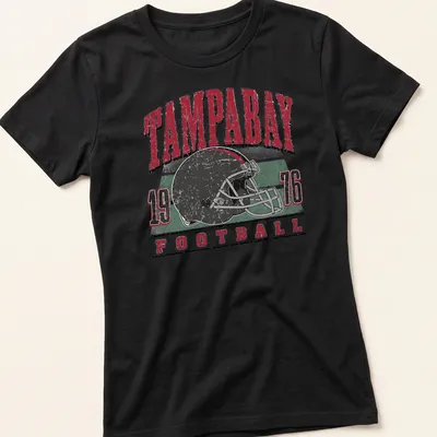 Retro distressed Tampa Bay football helmet t-shirt with bold lettering — printed on a women's shirt