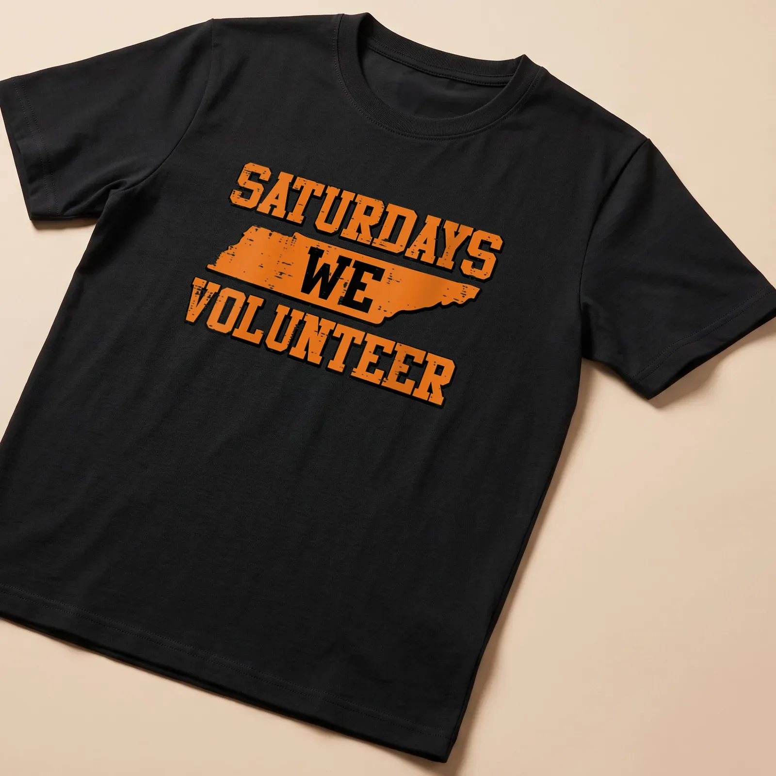 Distressed Tennessee outline with the text Saturdays We Volunteer in orange and black. — printed on a unisex t-shirt