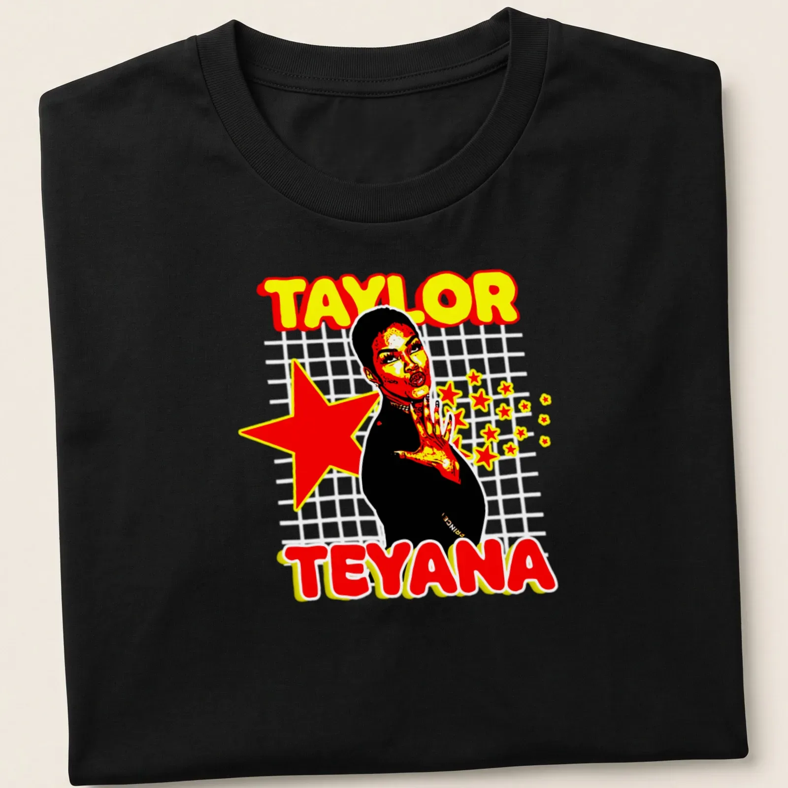 Retro Teyana Taylor t-shirt with bold typography in red, yellow, black, and white — printed on a unisex t-shirt