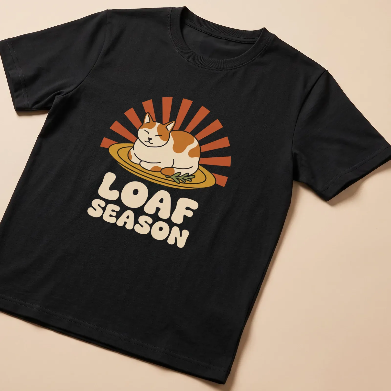 Humorous Thanksgiving Cat Loaf Season t-shirt with retro printed text and cartoon cat — printed on a unisex t-shirt