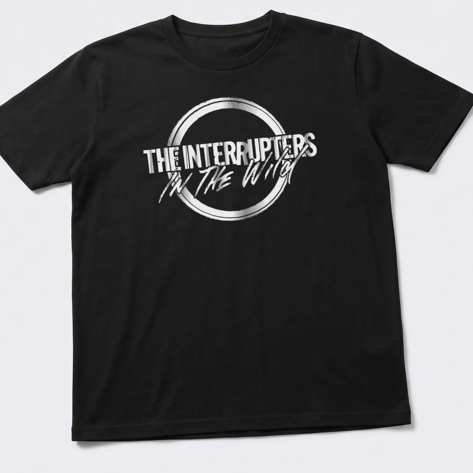 Metallic lettering of The Interrupters In The Wild shirt in silver and black — printed on a unisex t-shirt