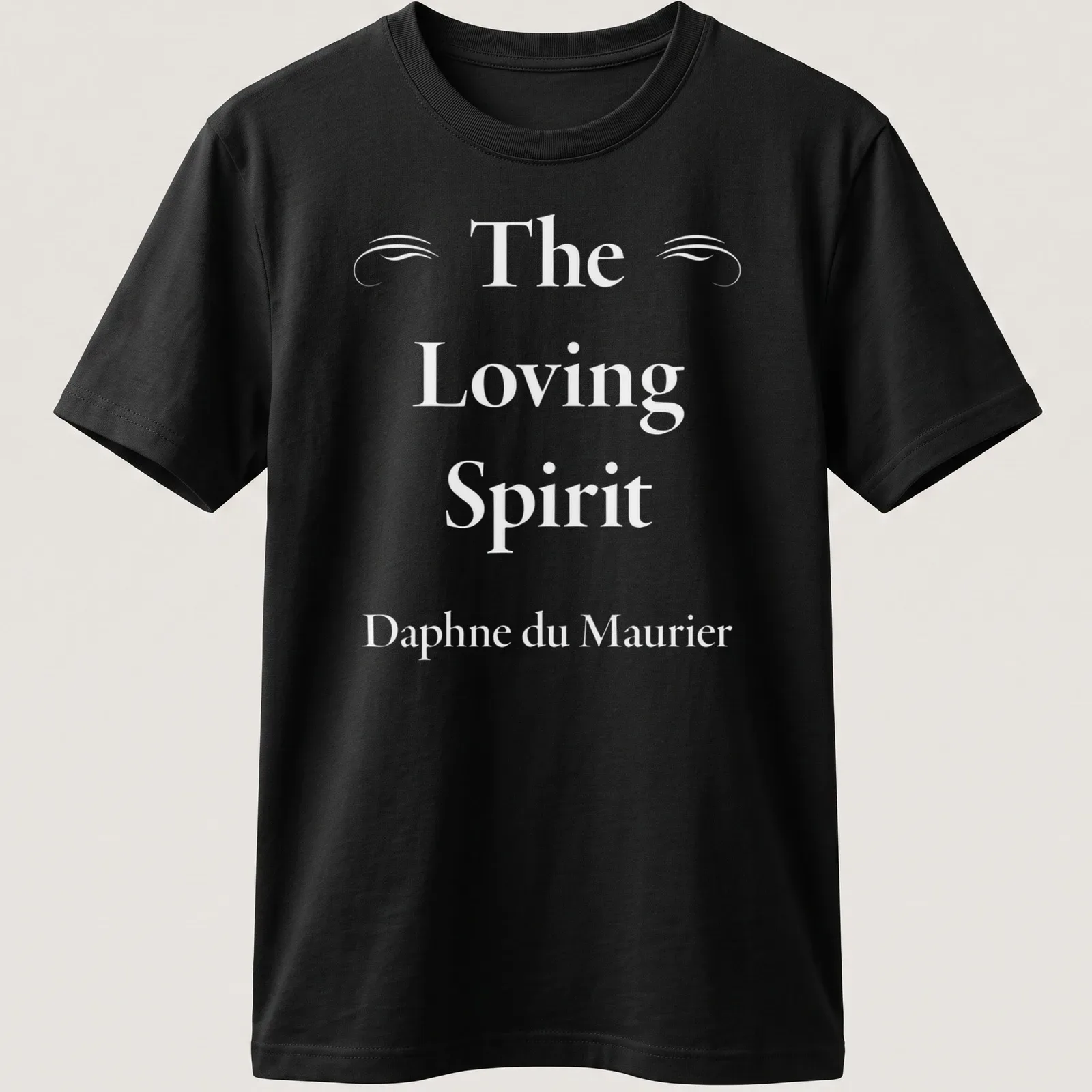 Elegant serif lettering of The Loving Spirit by Daphne du Maurier on a white — printed on a unisex t-shirt