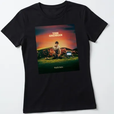 Vibrant surreal Tom Grennan t-shirt with colorful text and design — printed on a women's shirt