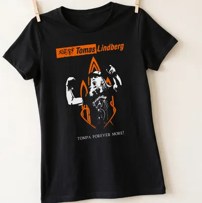 Bold typography T-shirt featuring Tomas Lindberg Forever text in orange and white — printed on a women's shirt