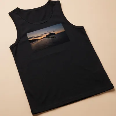 Photographic print of a tranquil harbor at sunset with golden and blue hues — printed on a tank top