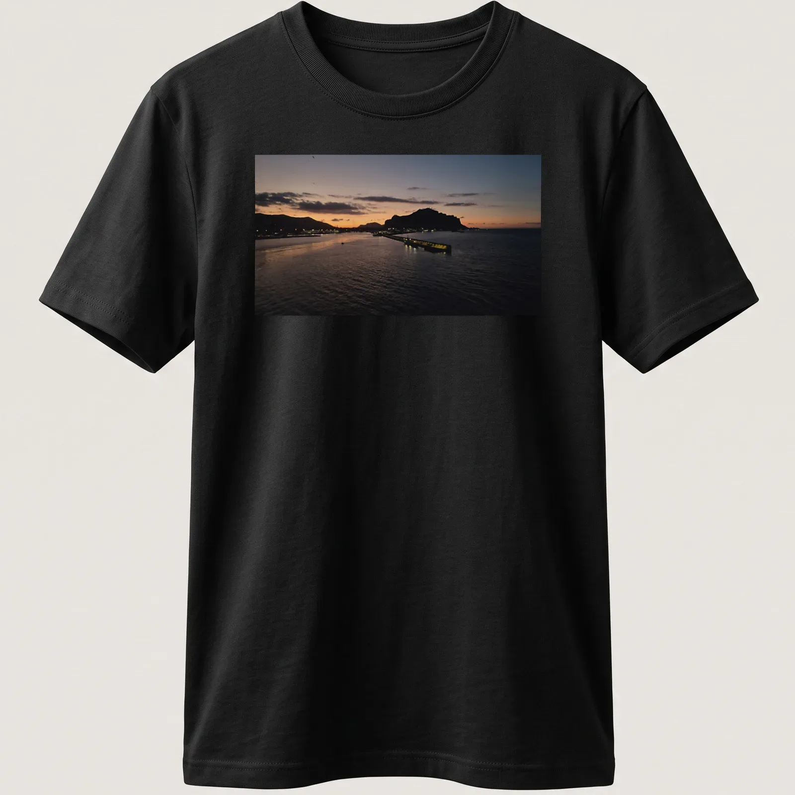 Photographic print of a tranquil harbor at sunset with golden and blue hues — printed on a unisex t-shirt