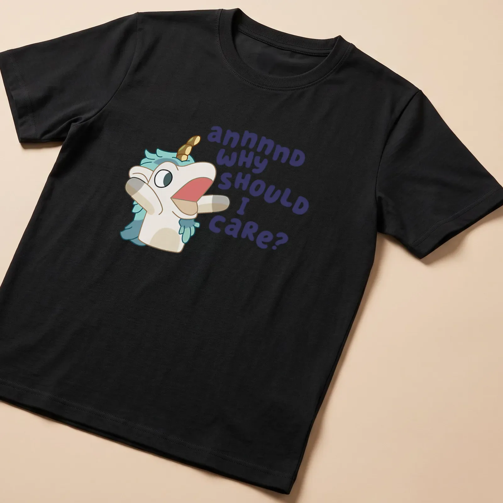 Kawaii unicorn character with text 'annnnd WHY SHOULD I CARE?' in pastel colors — printed on a unisex t-shirt