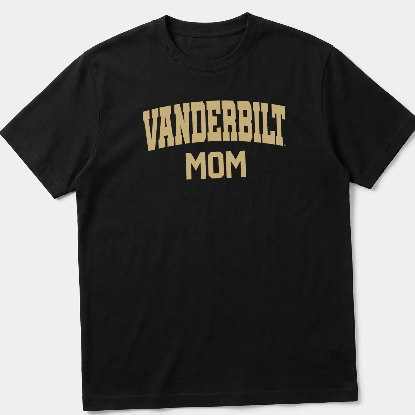 Gold VANDERBILT MOM text on white background in collegiate style — printed on a unisex t-shirt