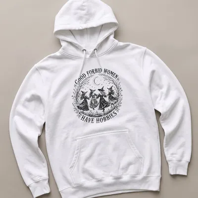 Vintage black and white shirt with witches and sarcastic text about hobbies. — printed on a unisex hoodie