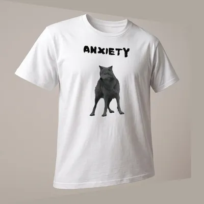 Realistic wolf print with the word ANXIETY in black and gray — printed on a unisex t-shirt (angled view)