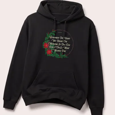 Watercolor wreath design with humorous text about breaking windows — printed on a unisex hoodie