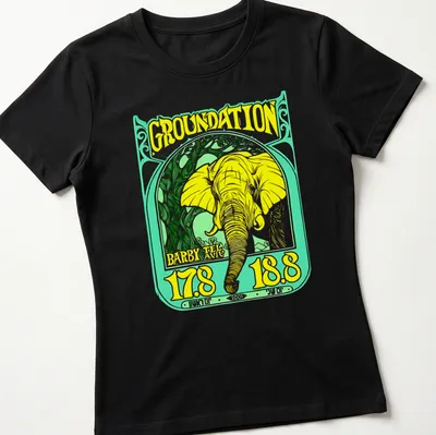 Vintage-style t-shirt featuring a yellow elephant and reggae-themed text. — printed on a women's shirt
