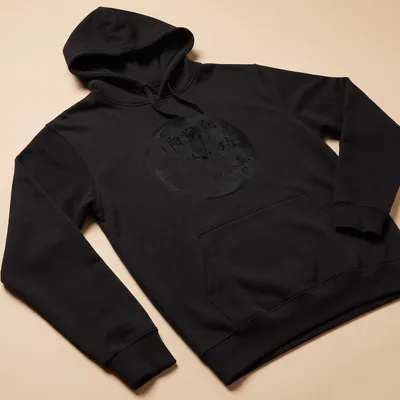 Distressed t-shirt featuring the Yin Yang symbol and Qigong text in black and white — printed on a unisex hoodie